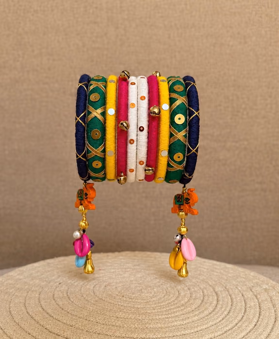 Raas Rang multicolour handmade Navratri thread bangle set with ghungroo and hanging charms by Kruki Dooki