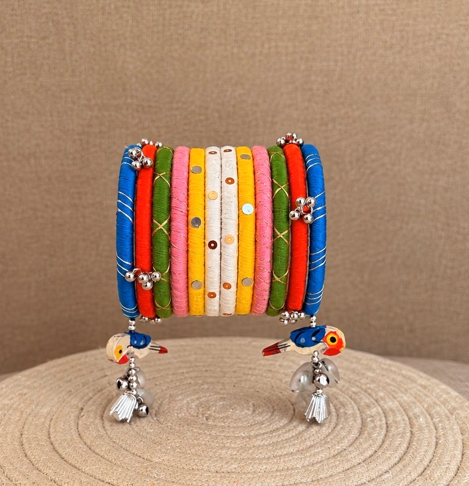 Rangotsav multicolour Navratri thread bangle set with bird charms and ghungroo by Kruki Dooki